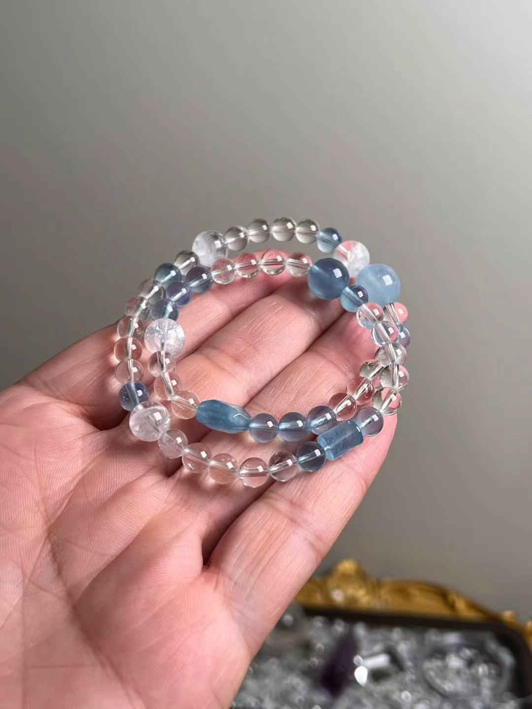 Hero view — multi-wrap aquamarine, clear quartz and white phantom quartz bracelet (11.5–6.5 mm accents).