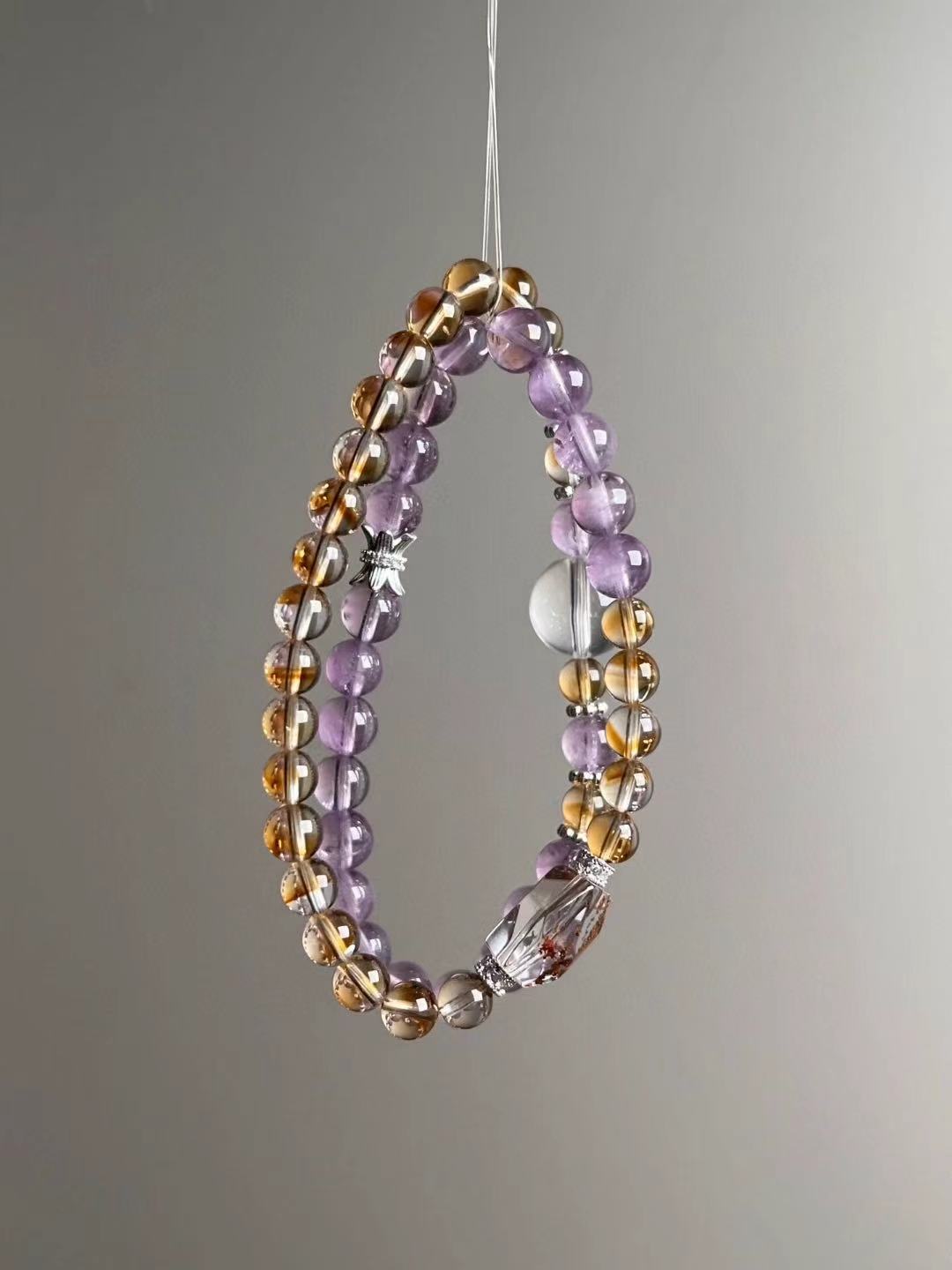 Hanging view — two slim strands with Amethyst and golden Citrine, plus Clear Quartz orb and faceted Phantom Quartz focal.