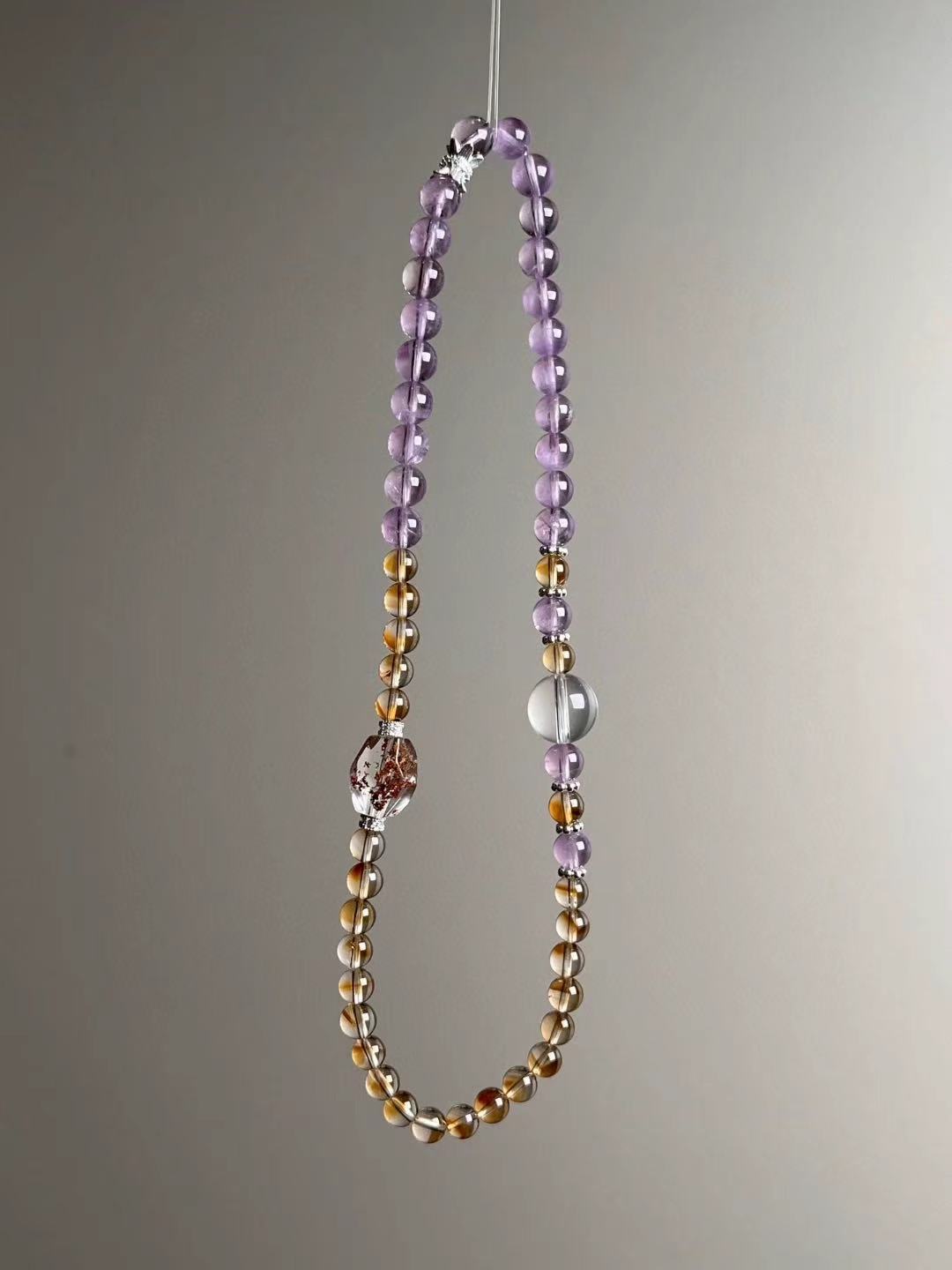 Full layout — elongated loop showing Amethyst line and Citrine/Clear Quartz mix with Phantom Quartz focal bead