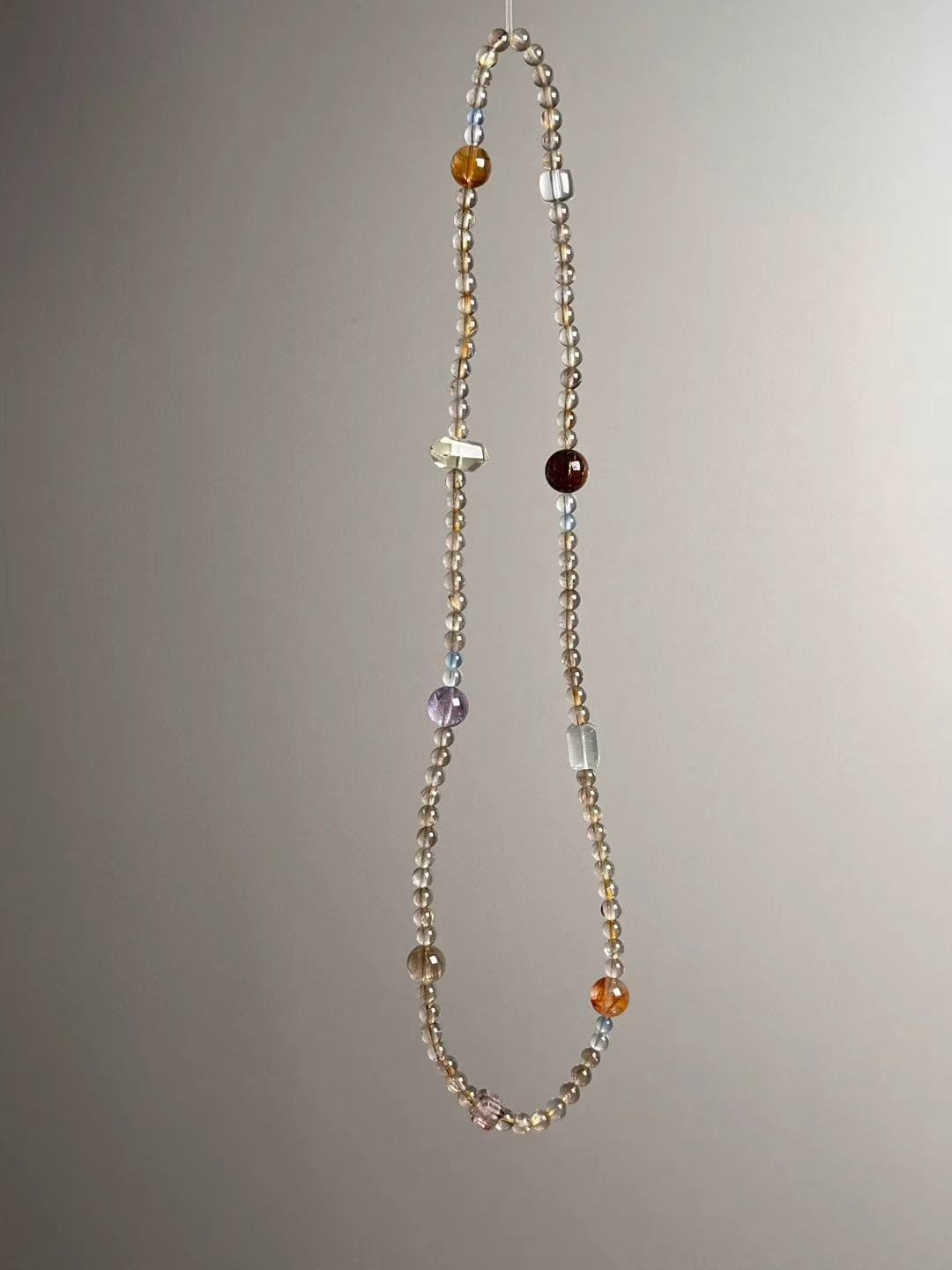 Side angle — Yellow Citrine double-terminated point and Amethyst round accent visible.
