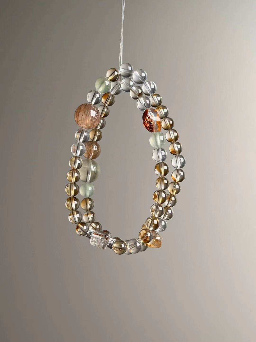 Hero view — multi-wrap bracelet featuring Citrine tower bead, Clear Quartz, rutilated cube accent, Prehnite and Orange Phantom, approx. 12–6.5 mm.