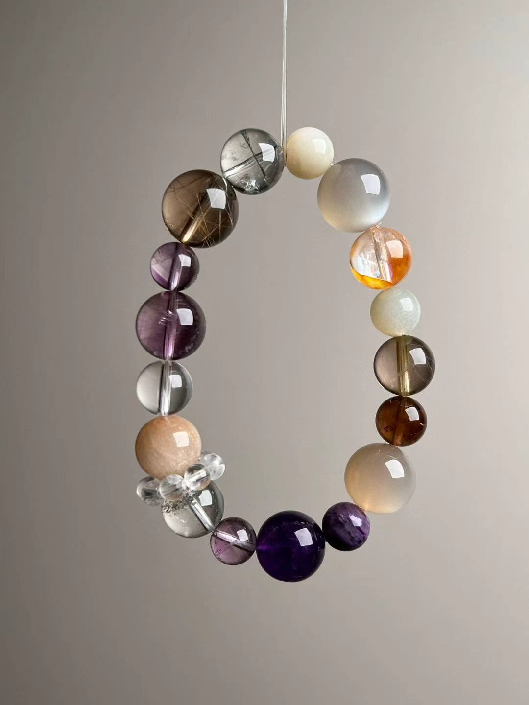 Angled hero view—mix of Orange & White Moonstone, Green Phantom Quartz, Amethyst, Clear Quartz and Golden Rutilated Quartz