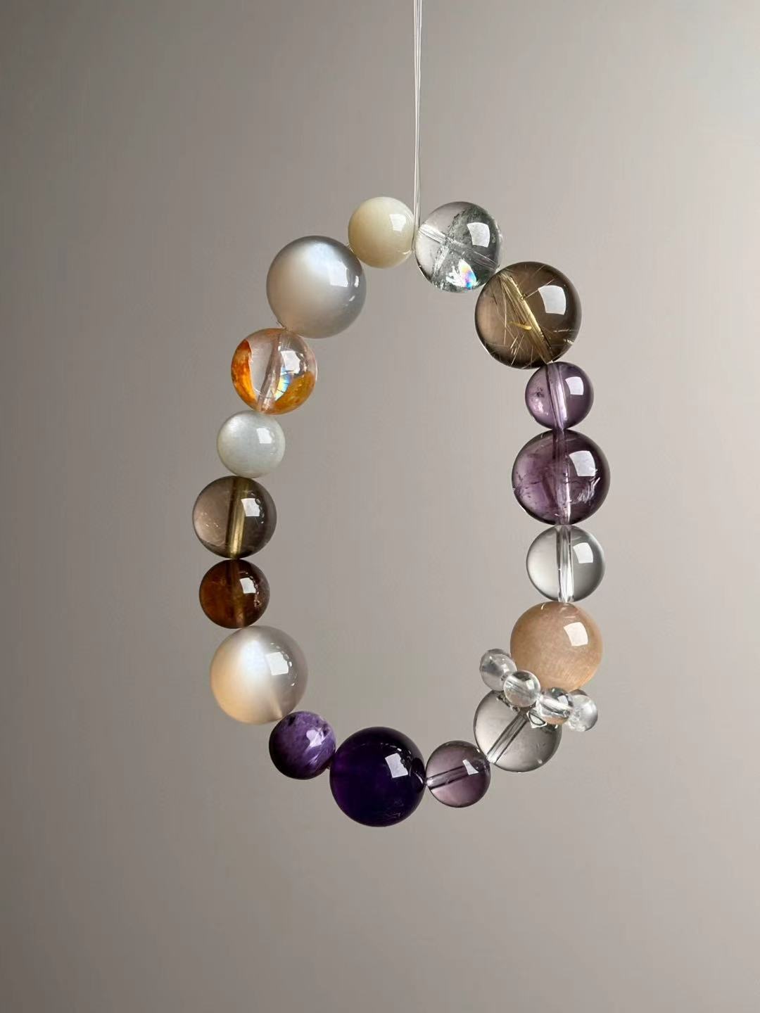 Second angled view—14.5–9 mm beads with Clear Quartz runner, bead-cluster spacer and Yellow Rutilated Quartz highlights