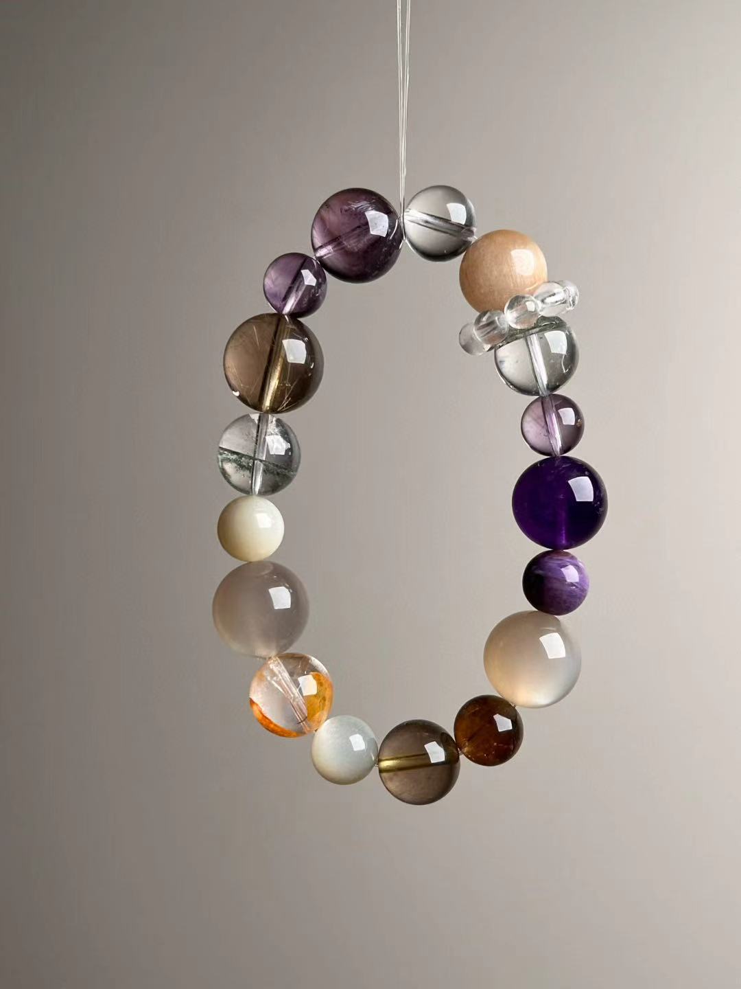 Macro texture—polished Orange Moonstone, Auralite-23, Golden and Yellow Rutilated Quartz, White Moonstone, Clear & Green Phantom Quartz