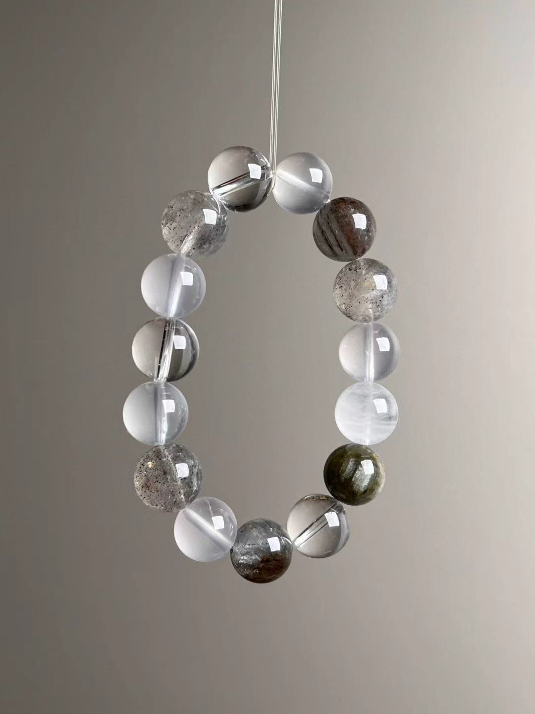 Angle view highlighting white phantom (four seasons garden) textures beside translucent milky quartz and clean clear quartz.