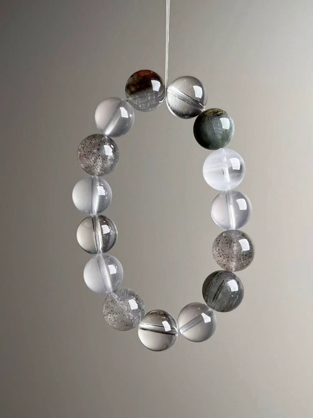 Full bracelet circle emphasizing clean drill lines, luminous selenite-like milkiness and speckled phantom quartz