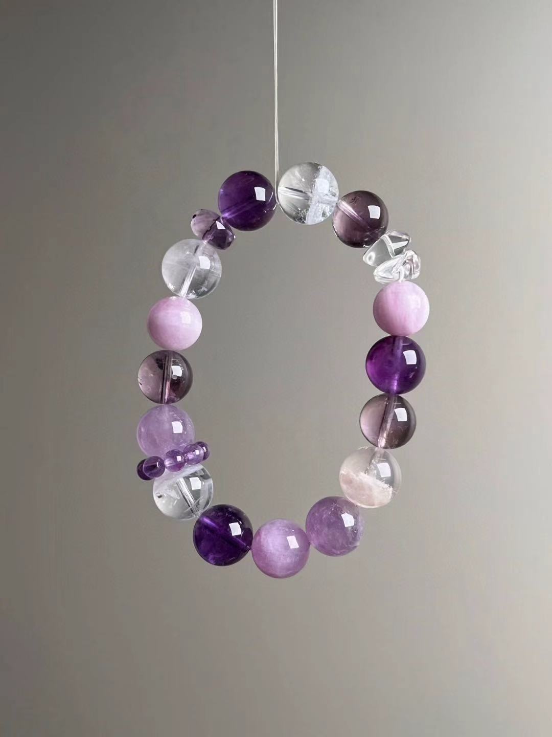 Angled hero—Amethyst focus with translucent Clear Quartz and purple Lepidolite; purple bead-cluster spacer visible