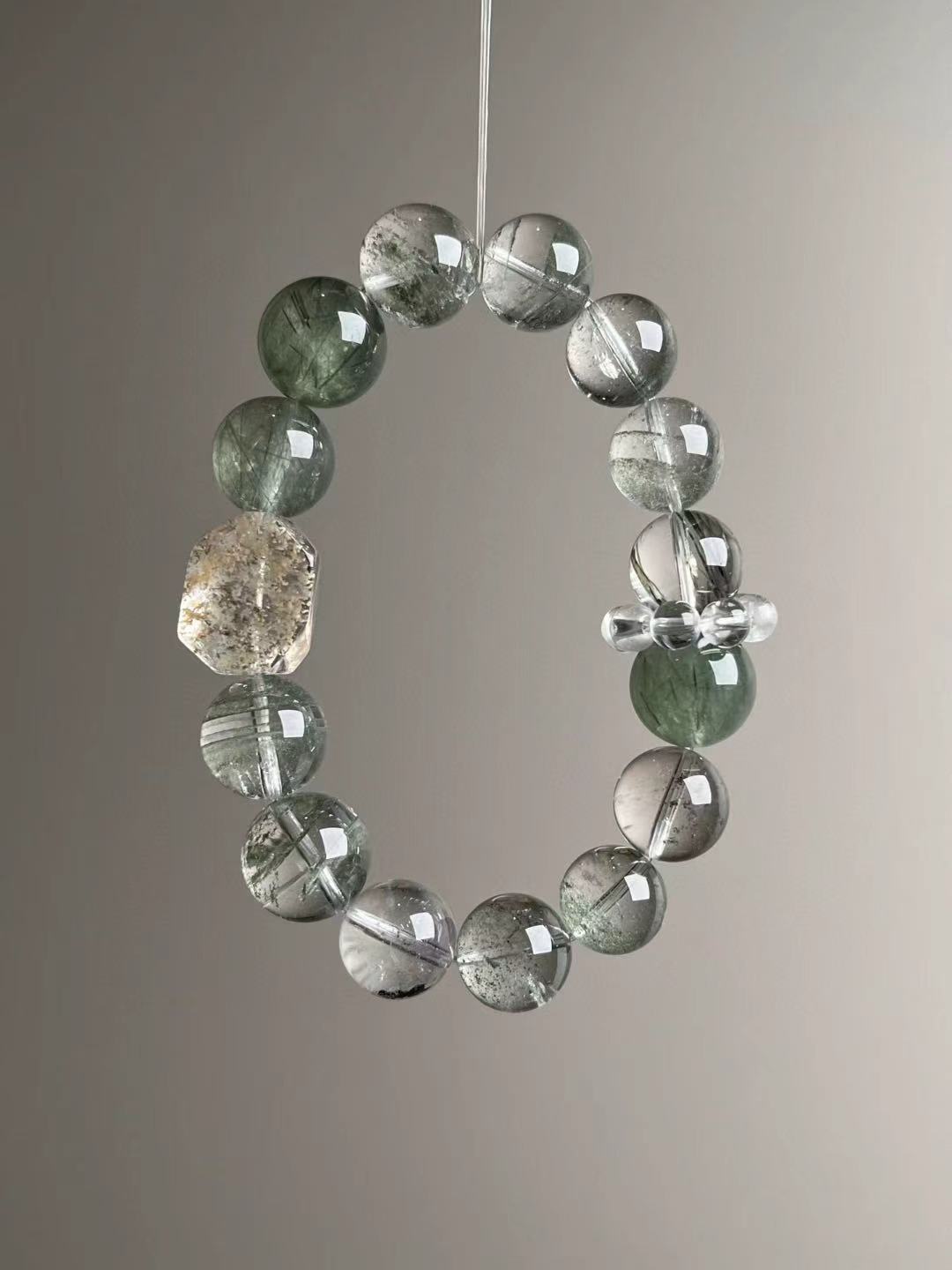Angled hero—yellow-green phantom focal with clear-quartz bead-cluster spacer