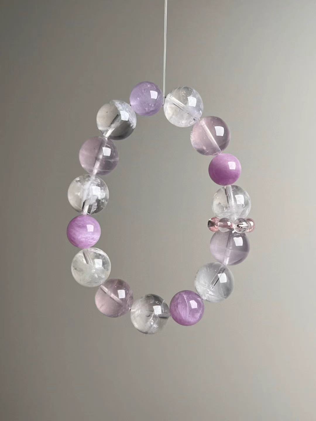 Macro texture—polished Rose Quartz, White Phantom Quartz and Lepidolite beads, 14–11 mm