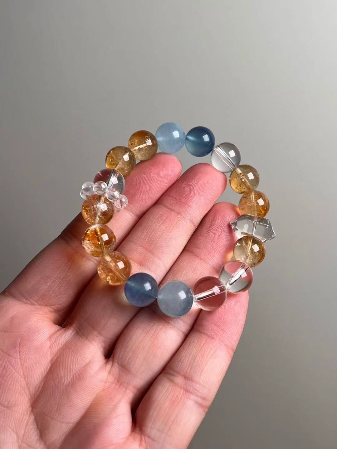 Front hero—Aquamarine, Yellow Azeztulite & Clear Quartz 12 mm beaded bracelet with double-terminated clear quartz accent.