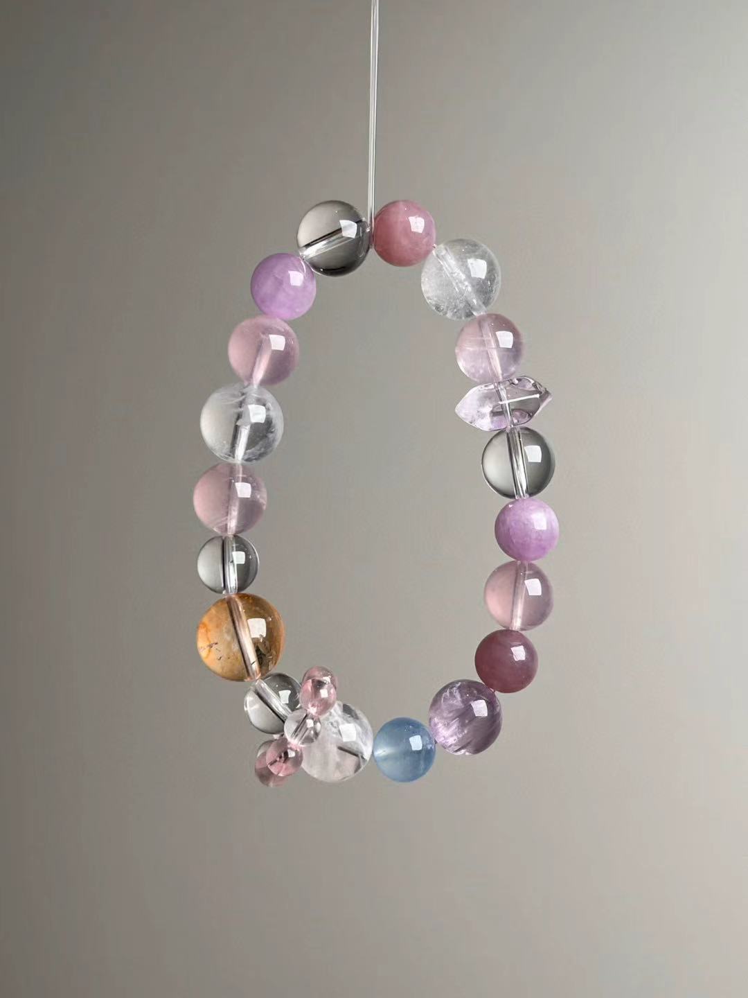 Second angled view—mixed 13–9 mm beads including rose quartz, lepidolite, aquamarine accent and clear quartz.