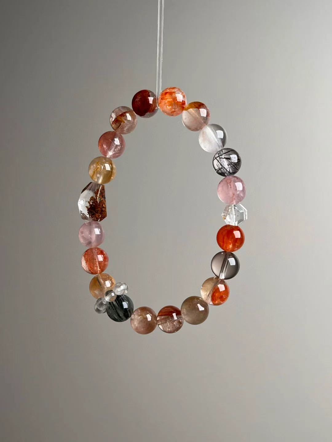 Angled view—rose and honey beads with Koi Flower resin focal and smoky-clear accents, ≈9 mm