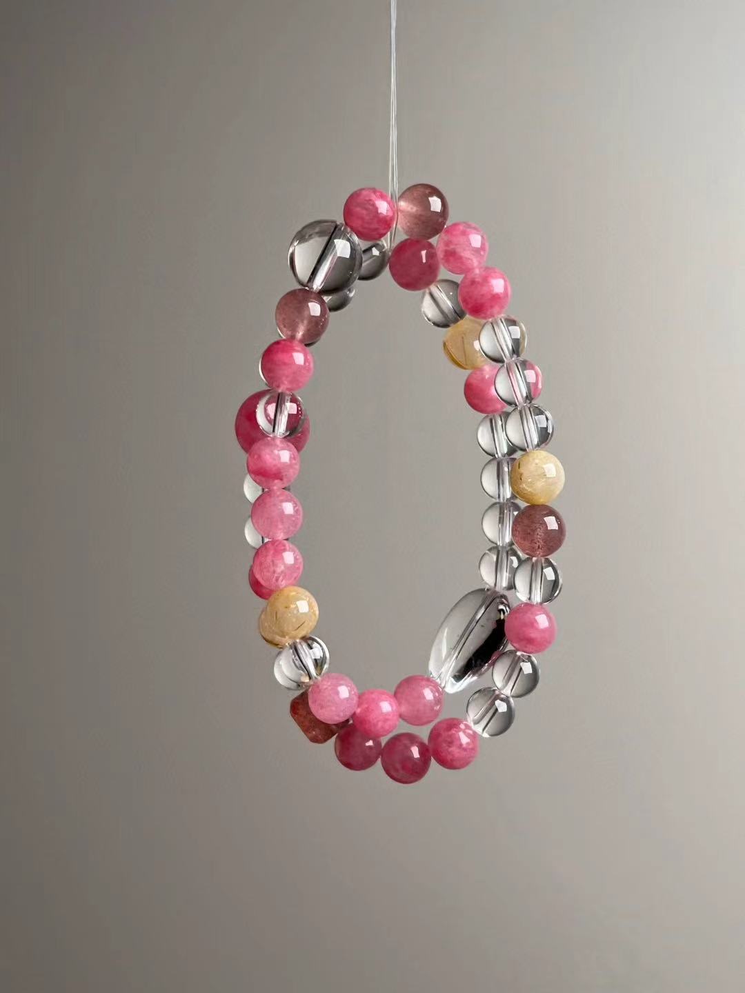 Second angled view—mixed 11.5–7 mm pink beads with Clear Quartz spacers and Golden Rutilated Quartz highlights