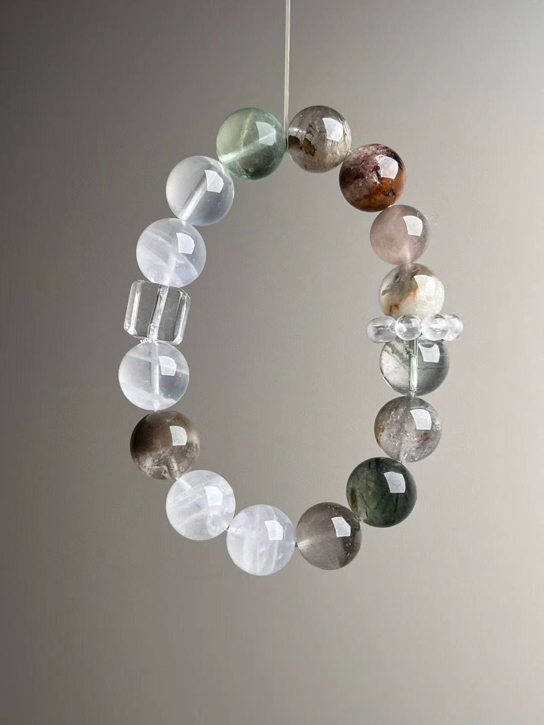 Full-length view of the multi-gem 12–13 mm bracelet; symbolic amplifier beadwork.