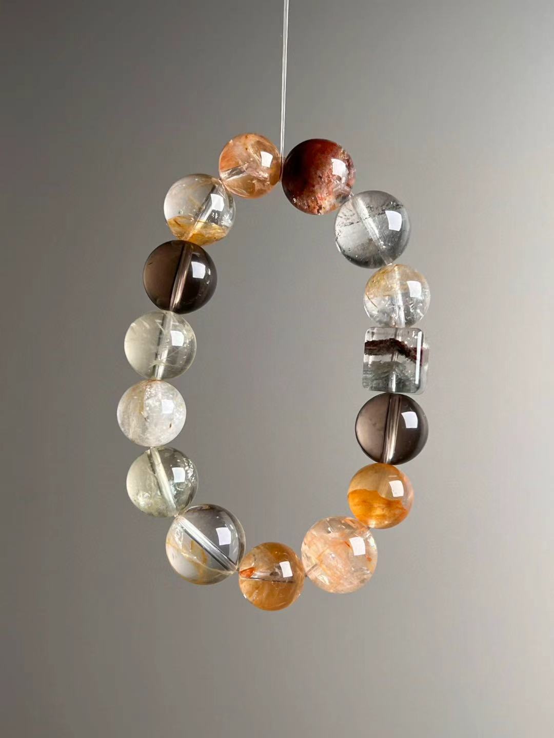 Angled hero—square rainbow phantom “sugar-cube” bead with warm orange phantom tones