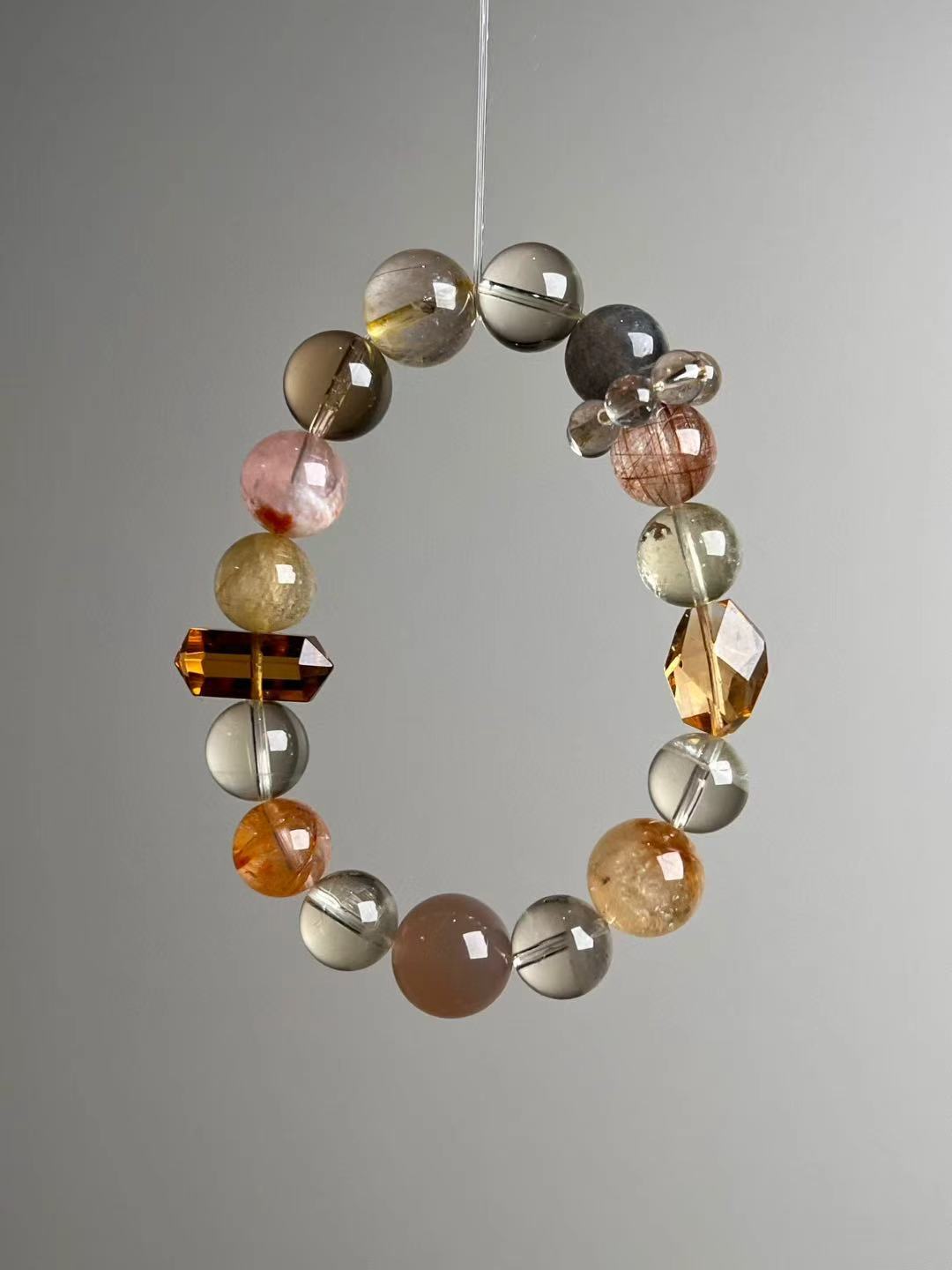 celestial-crystal-golden-wealth-matrix-14-11mm-hero-angle-a