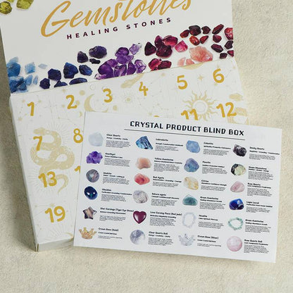 Close view of the calendar doors and printed guide—24 numbered windows for a day-by-day crystal ritual.