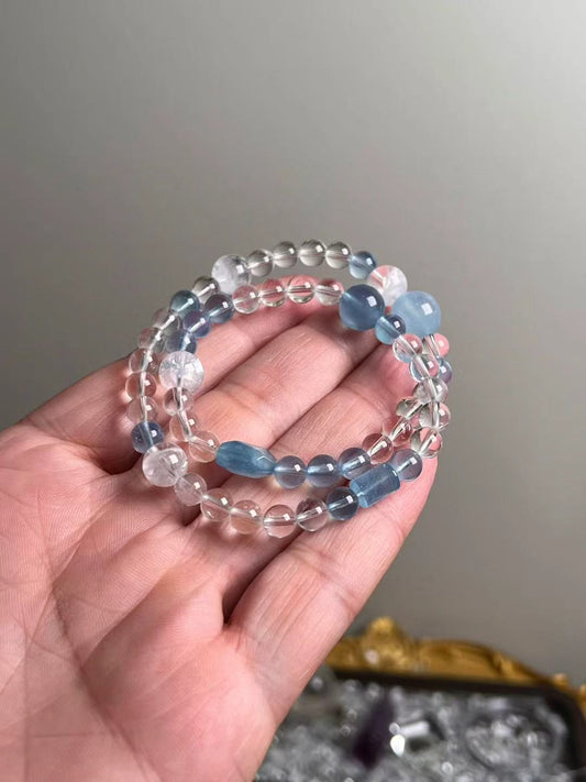 Hero view — multi-wrap aquamarine, clear quartz and white phantom quartz bracelet (11.5–6.5 mm accents).