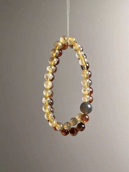 Full layout — two slim strands showing alternating Black-Gold Super Seven and Golden Rutile, elastic stringing, 11–7 mm.