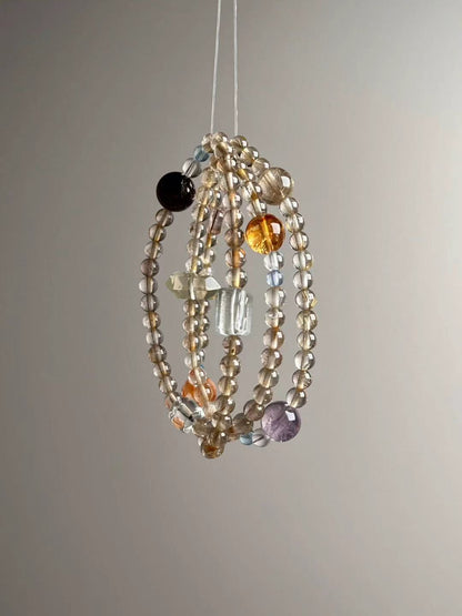 Full layout — slim 3-wrap strand featuring Golden Rutile, Clear Quartz, Green Phantom, Aquamarine and Super Seven.