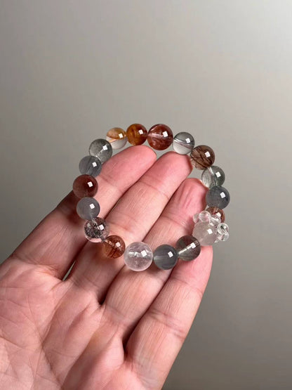 Hero — multi-gem energy bracelet featuring Black Super Seven, Blue Rutilated Quartz, Green & White Phantom Quartz, red/yellow koi flower quartz and gray hair quartz (12–10 mm).
