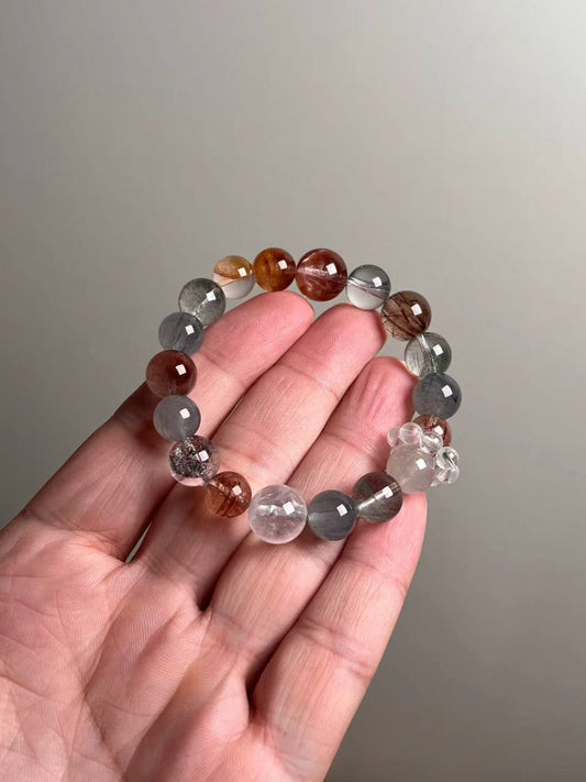 Hero — multi-gem energy bracelet featuring Black Super Seven, Blue Rutilated Quartz, Green & White Phantom Quartz, red/yellow koi flower quartz and gray hair quartz (12–10 mm).