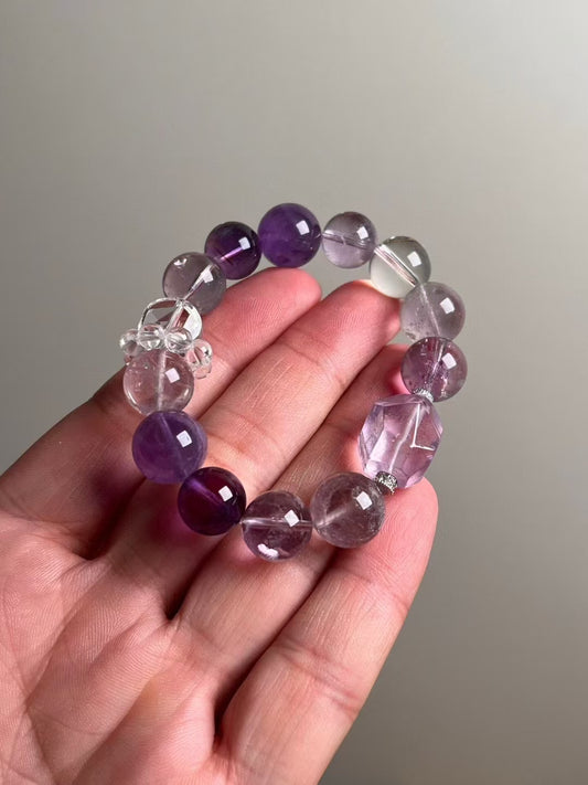 Hero — Amethyst and Clear Quartz bracelet with Purple Azeztulite centerpiece and clear-quartz runner cluster, 13.6–12 mm bead