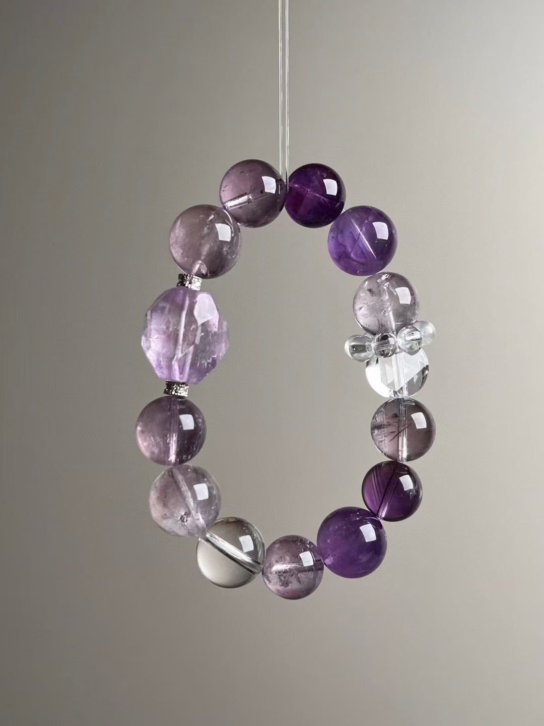 Full layout — bracelet circle showing gradient from deep to light amethyst with clear quartz accents