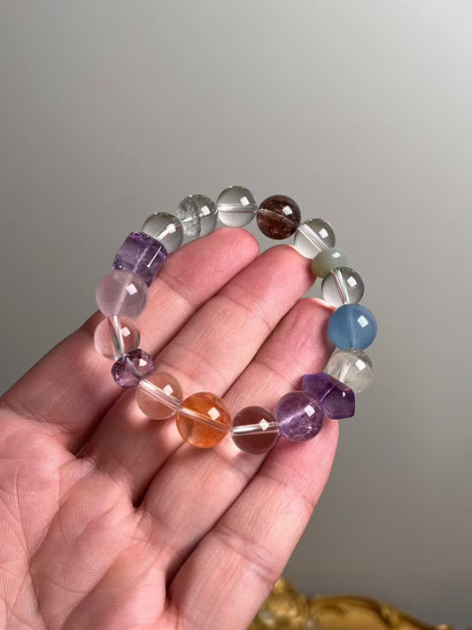 Hero view — multi-gem bracelet with Amethyst DT focal, Citrine, Aquamarine, Clear Quartz, Hetian jade, Copper Rutile.
