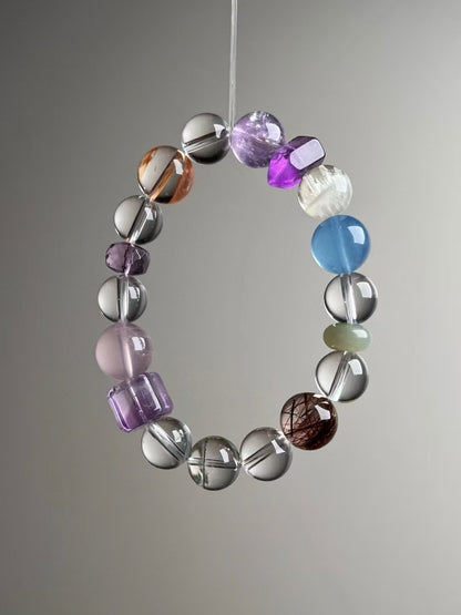 Close detail — purple cube and Rose Quartz with Clear Quartz; Copper Rutile & Green Phantom rounds