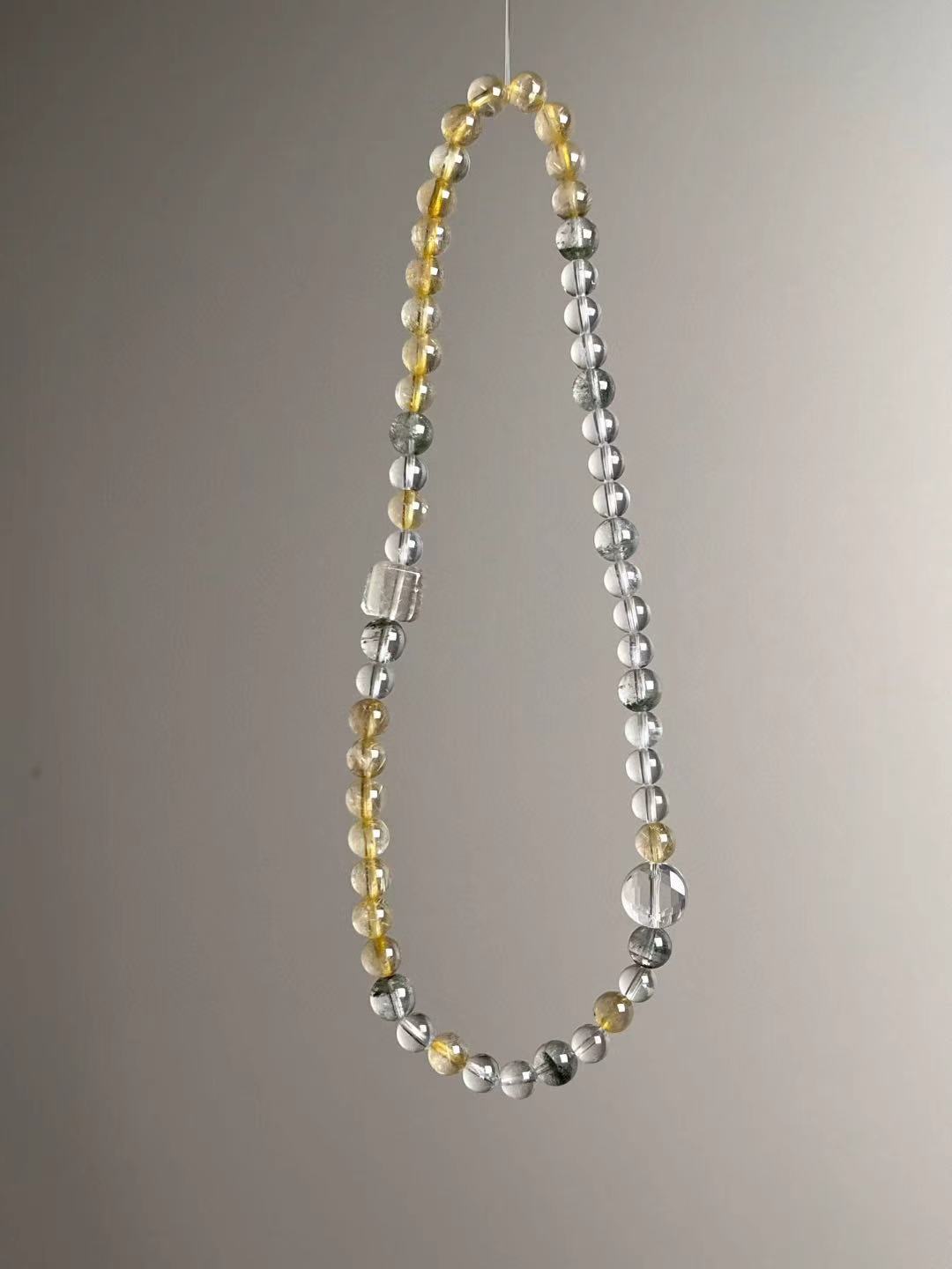 Side layout — alternating sections of Golden Rutile and Clear Quartz with Green Phantom pops.
