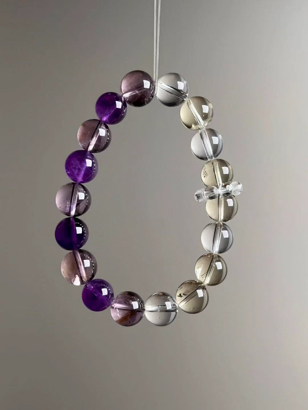 Flat lay grid — component callouts of Amethyst, Citrine and Clear Quartz trinity bracelet.