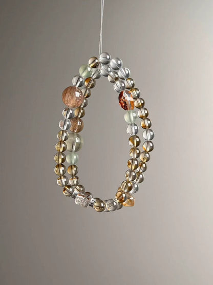 Hero view — multi-wrap bracelet featuring Citrine tower bead, Clear Quartz, rutilated cube accent, Prehnite and Orange Phantom, approx. 12–6.5 mm.