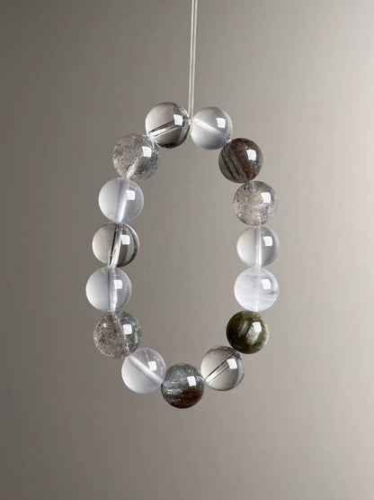 Angle view highlighting white phantom (four seasons garden) textures beside translucent milky quartz and clean clear quartz.