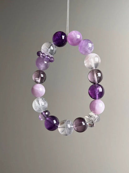 Angled hero—mixed light and deep purple beads, White Phantom and Clear Quartz accents, 12.5–11.5 mm