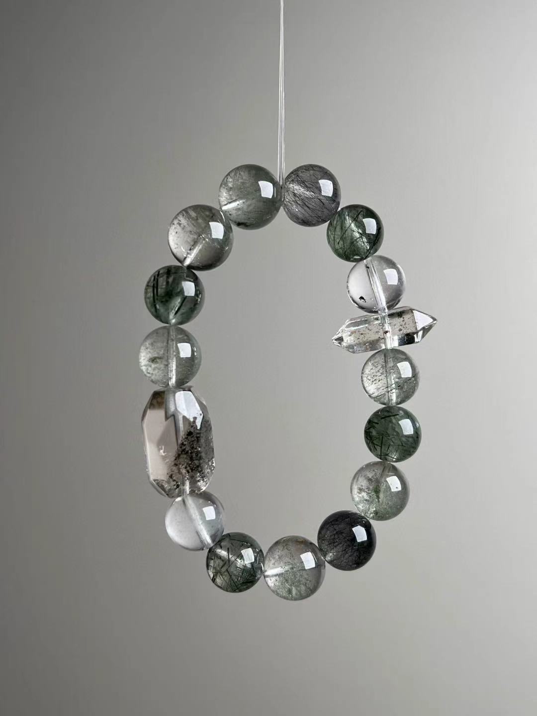 Macro texture—polished Green Phantom, Black Flash Quartz, Green & Black Rutilated Quartz with double-terminated quartz accent