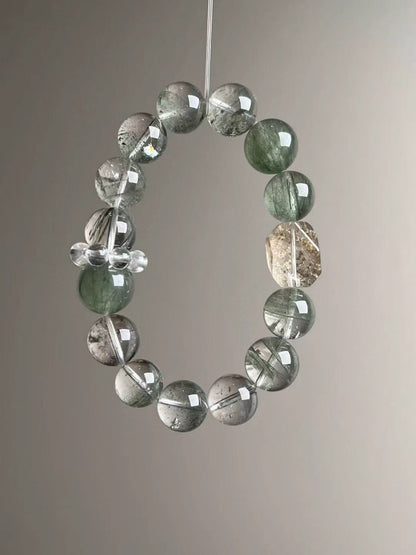 Angled hero—Green Rutilated Quartz needles and translucent Green Phantom spheres, 12–13.5 mm.