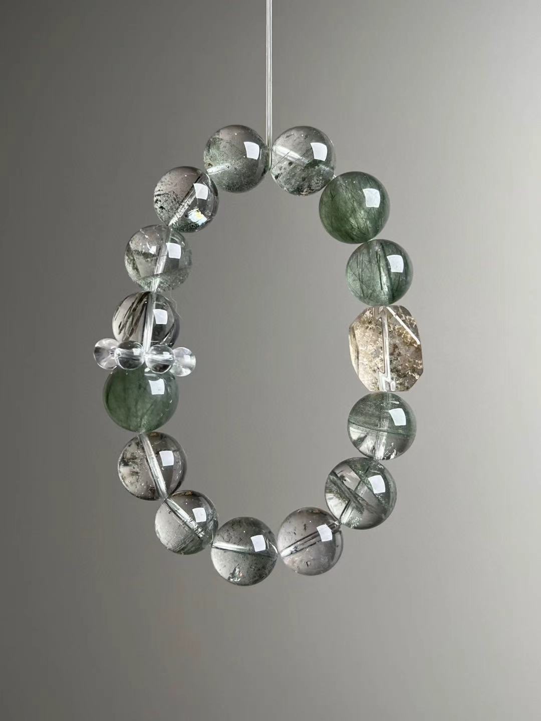 Macro texture—polished Green Phantom Quartz, Herkimer-style quartz point, Green Rutilated Quartz and clear-quartz cluster detail