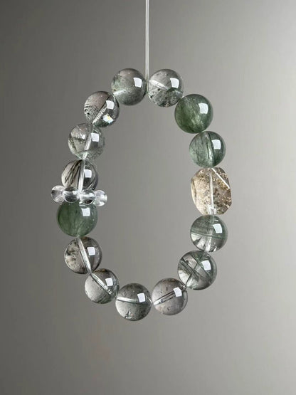 Macro texture—polished Green Phantom Quartz, Herkimer-style quartz point, Green Rutilated Quartz and clear-quartz cluster detail