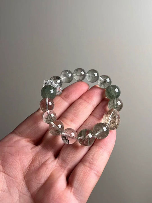 On-hand photo—12–13.5 mm bracelet with Green Phantom Quartz, Herkimer quartz point, Green Rutilated Quartz and a clear-quartz bead-cluster spacer