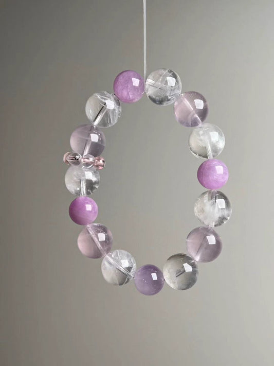 Front hero—Rose Quartz, White Phantom Quartz and Lepidolite 14–11 mm bracelet on grey background
