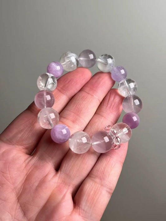On-hand photo—14–11 mm Rose Quartz, White Phantom Quartz and Lepidolite bracelet with pink bead-cluster spacer.