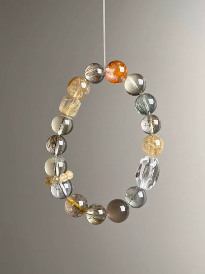 Second angled view—mixed gold, grey and green hues with Clear Quartz ripple bead and yellow cluster spacer