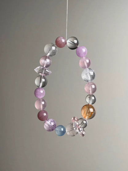 Detail—double-terminated rose quartz point bead and bead-cluster spacer on the Holo Love Matrix bracelet