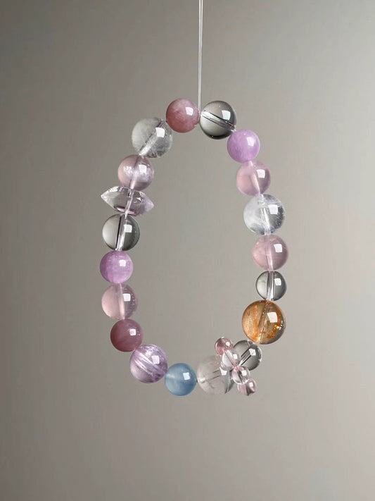 Front hero—Holo Love Matrix bracelet featuring rose quartz double-terminated bead, lepidolite and mixed clear quartz, 13–9 mm.