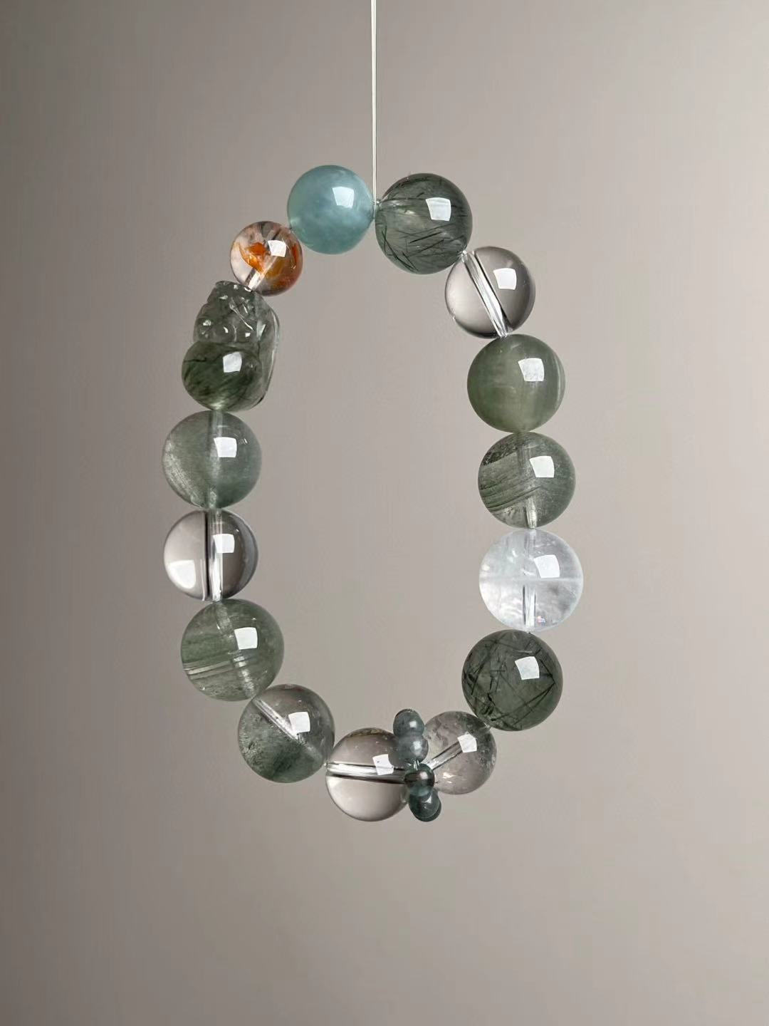 Angled hero—cool green palette; Green Rutilated Quartz, Clear Quartz, Green Phantom and White Phantom accents