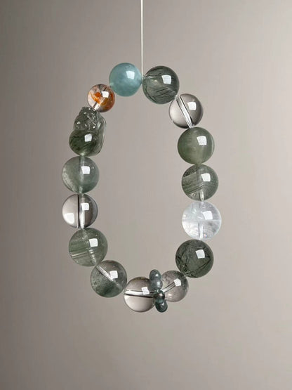 Angled hero—cool green palette; Green Rutilated Quartz, Clear Quartz, Green Phantom and White Phantom accents