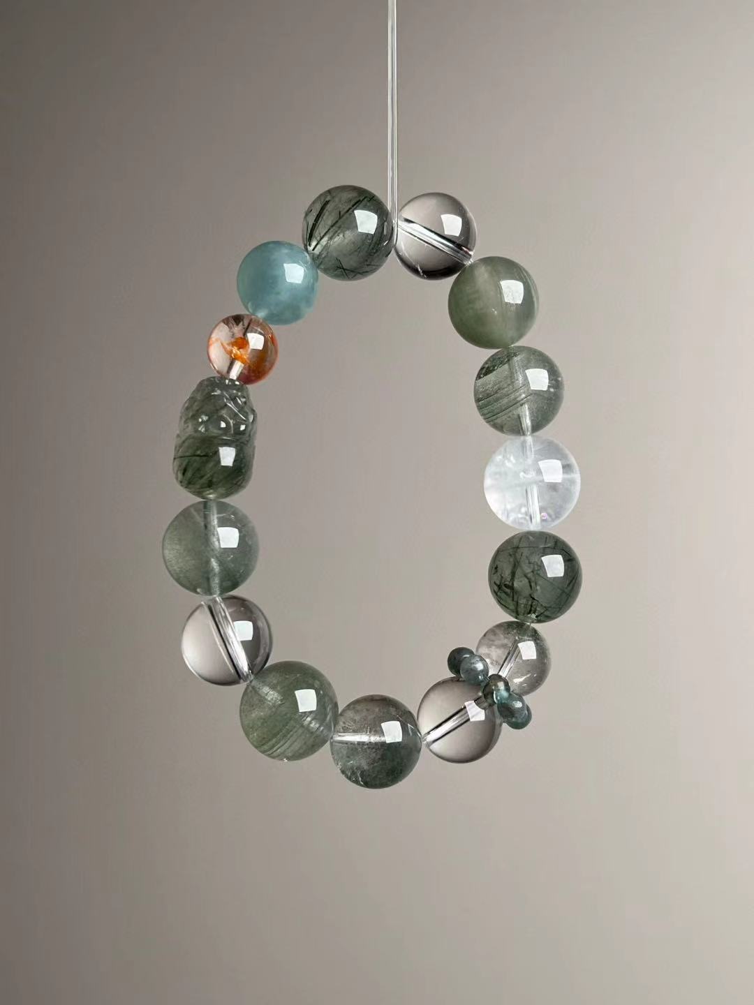 Macro texture—polished Green Rutilated Quartz with carved Pixiu, Clear Quartz, Green/White Phantom, Aquamarine and Apatite ring