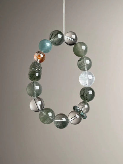 Macro texture—polished Green Rutilated Quartz with carved Pixiu, Clear Quartz, Green/White Phantom, Aquamarine and Apatite ring