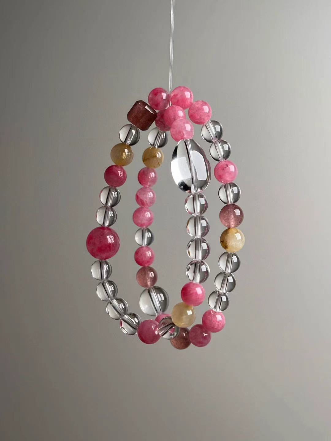 Front hero—Prosperity & Romance Matrix bracelet in pink and clear tones with Golden Rutilated Quartz accents, 11.5–7 mm